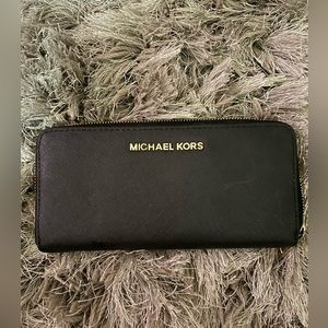 Black and gold Michael Kors slim full zip wallet